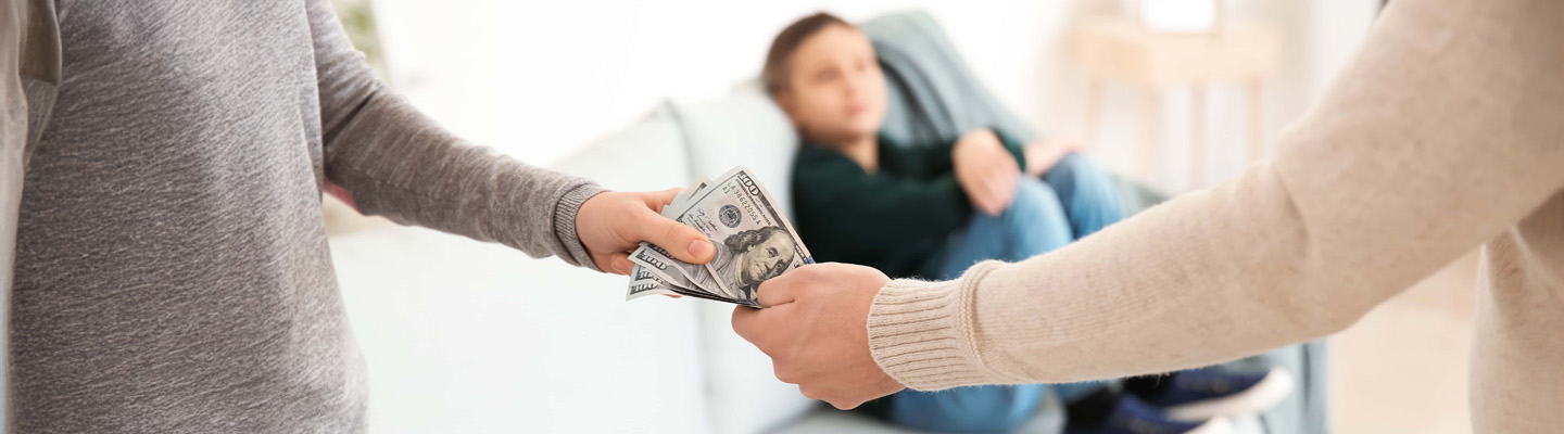 man giving alimony to his ex wife at home