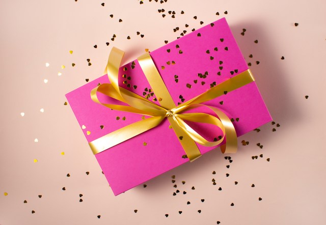 pink gift with gold ribbon and glitter