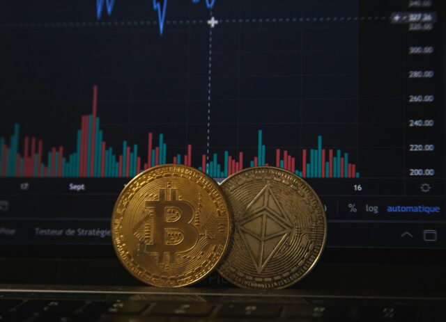 cryptocurrency in front of computer screen